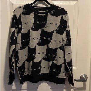 Adorable black cat reverse pattern sweater.
